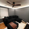 Installed Asheville Molding for Indirect Lighting creating soft perimeter ceiling illumination in a cozy modern room.