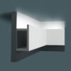 3D installation illustration of Asheville Molding for Indirect Lighting showing the molding mounted along the upper wall with concealed indirect lighting washing the ceiling.