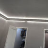 Installed New York 2-Way Molding for Indirect Lighting creating soft perimeter ceiling illumination in a contemporary interior.