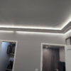 Installed New York 2-Way Molding for Indirect Lighting creating soft perimeter ceiling illumination in a contemporary interior.