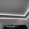 Installed New York 2-Way Molding for Indirect Lighting creating soft perimeter ceiling illumination in a contemporary interior.
