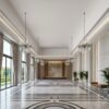 Installed Extra Tall Miami Art-Deco Baseboard adding elegant decorative trim details along the walls of a grand upscale interior.