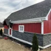 Volcano Ash Stacked Stone Panel Installation on a red house
