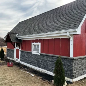 Volcano Ash Stacked Stone Panel Installation on a red house
