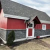 Volcano Ash Stacked Stone Panel Installation on a red house