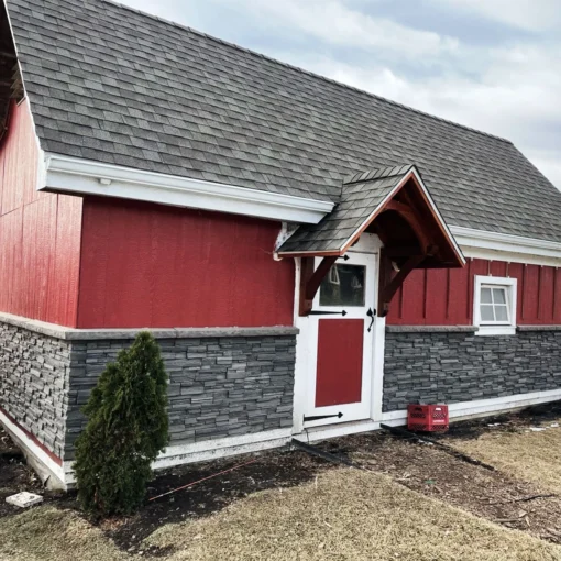 Volcano Ash Stacked Stone Panel Installation on a red house