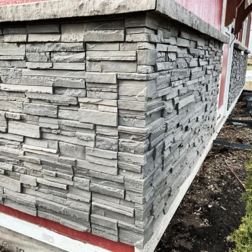 Volcano Ash Stacked Stone Panel Installation on a red house