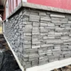 Volcano Ash Stacked Stone Panel Installation on a red house