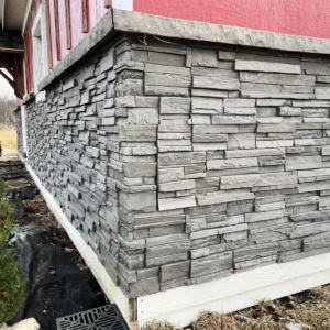 Volcano Ash Stacked Stone Panel Installation on a red house