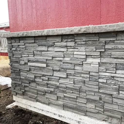 Volcano Ash Stacked Stone Panel Installation on a red house