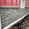 Volcano Ash Stacked Stone Panel Installation on a red house